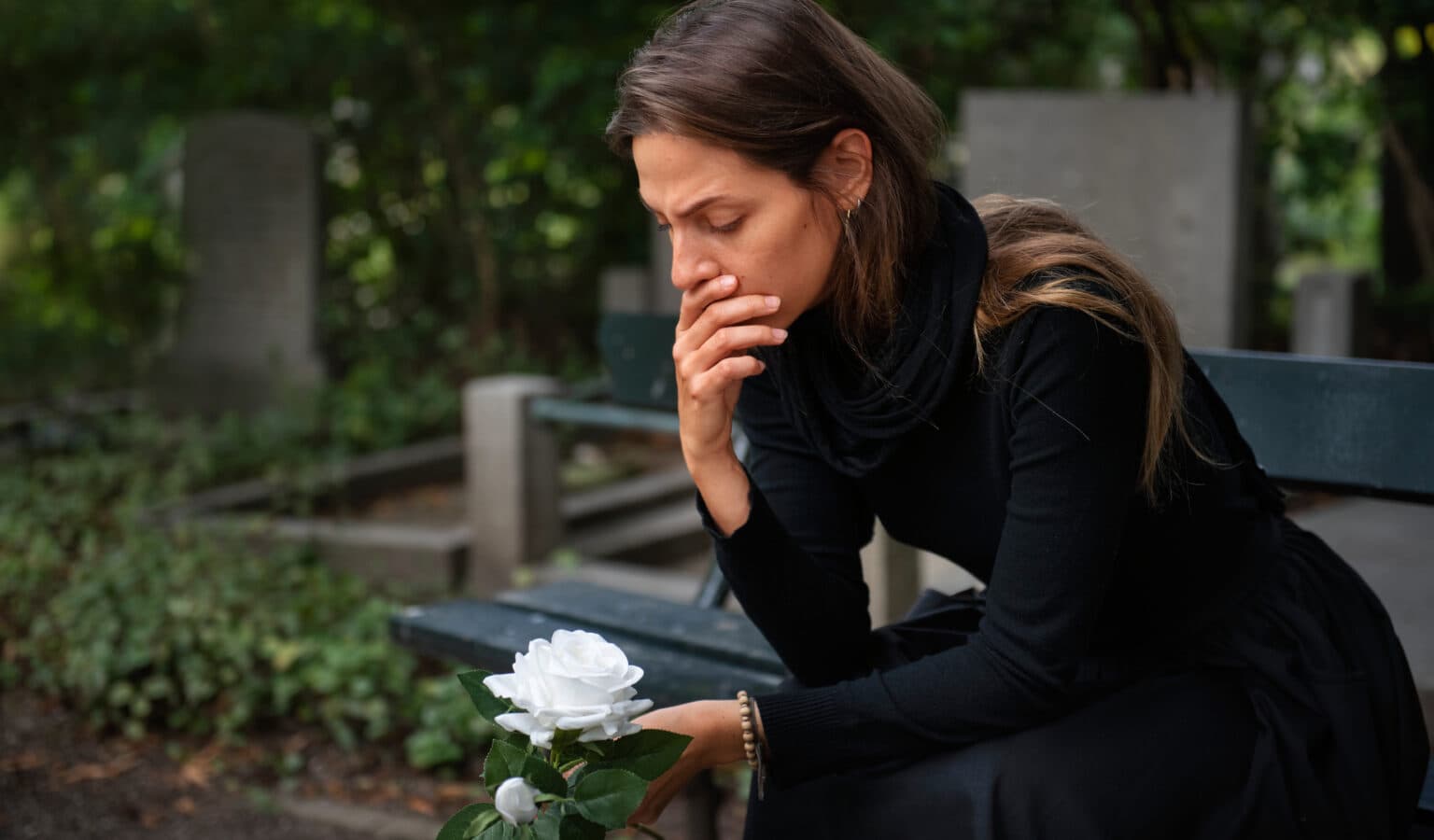 A person experiencing physical grief symptoms