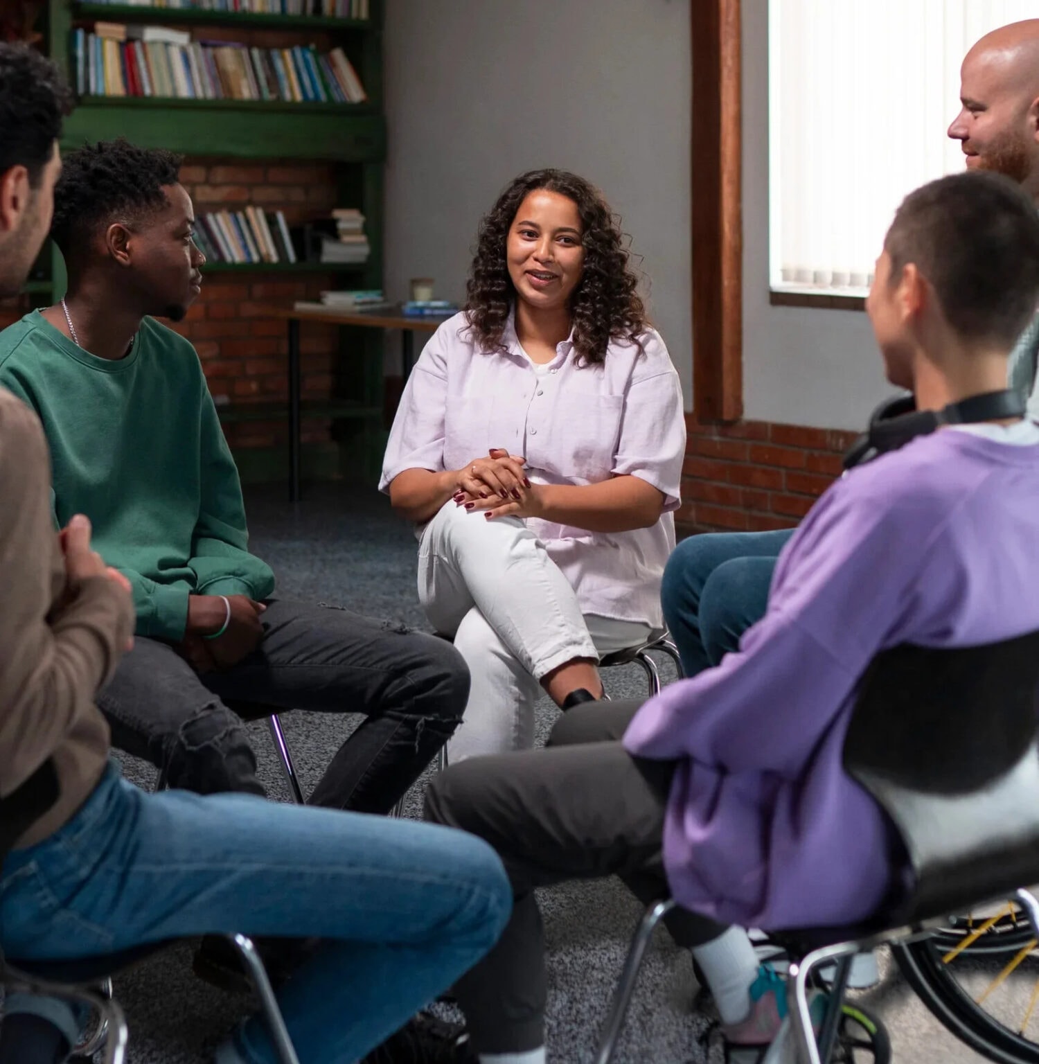 Adults sharing a conversation in a support group